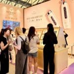 NICEMAY OEM and ODM beauty device booth with visitors viewing product displays at the Shanghai Beauty Expo.