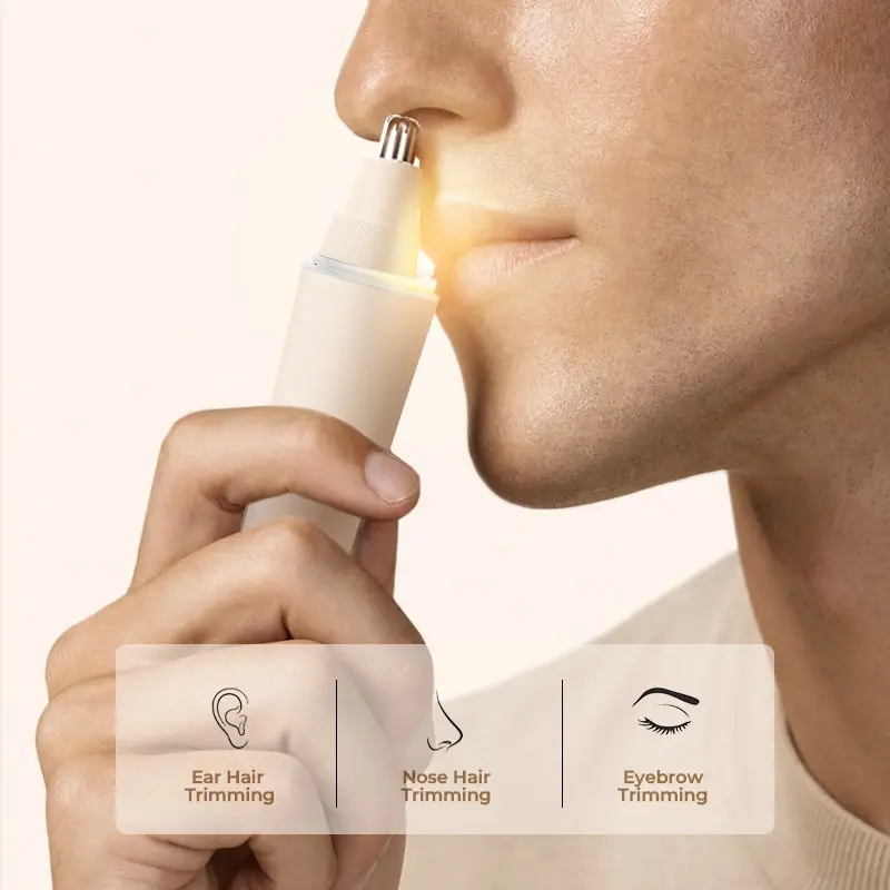 User using the NICEMAY QM-2065 trimmer for nose, ear, and eyebrow grooming.